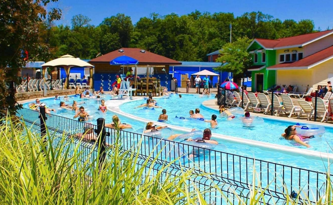 Family in the pool on tubes 