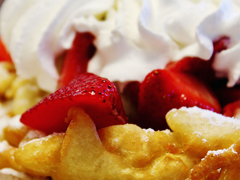 Funnel Cake with strawberries and whipped cream