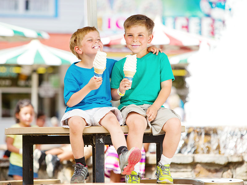 Two boys eating ice cream